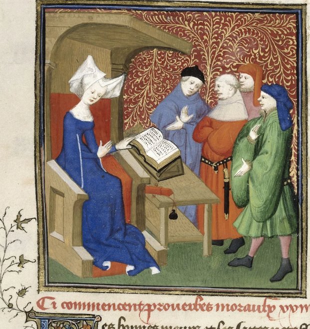A medieval manuscript illumination of a woman seated at a desk reading from an open book to a gathered audience